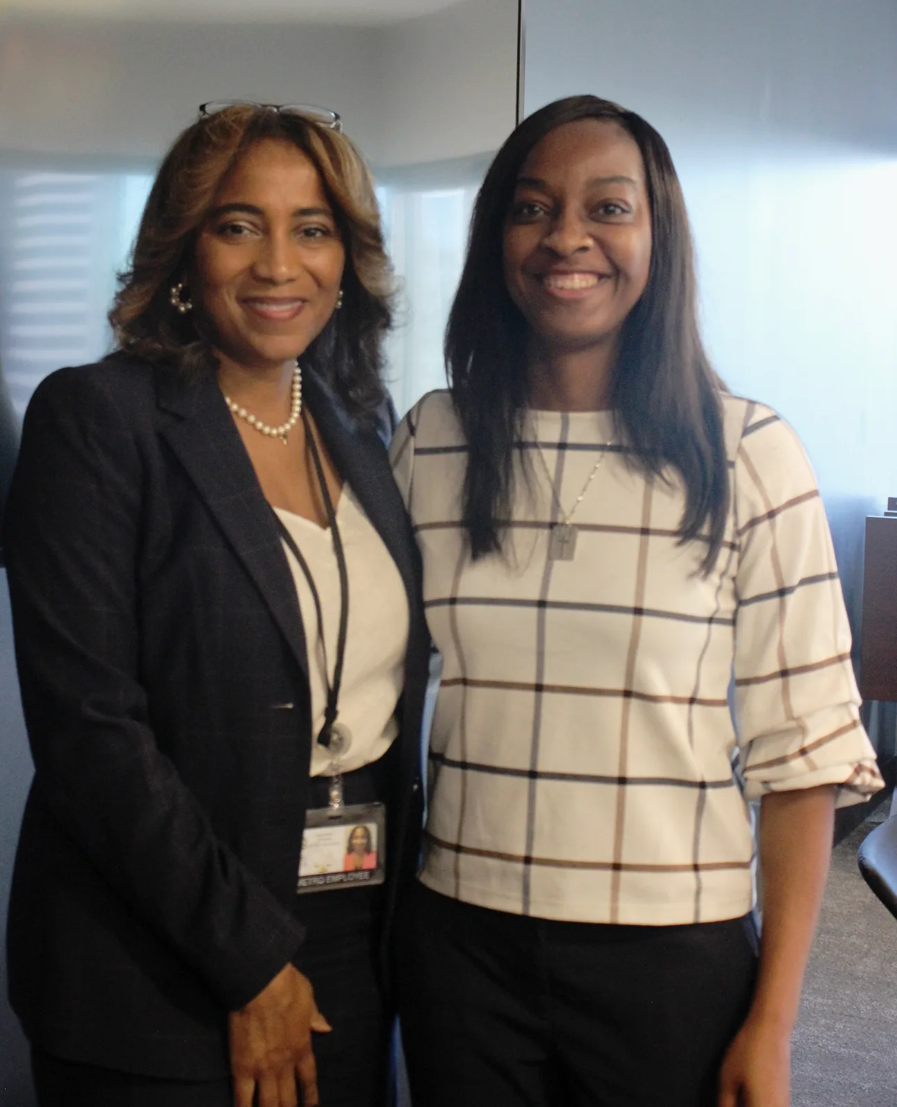 Two participants standing together for a portrait at the Nashville Bar Association CLE.